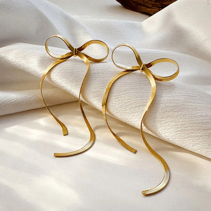 Tied & True – Gold Bow Drop Studs