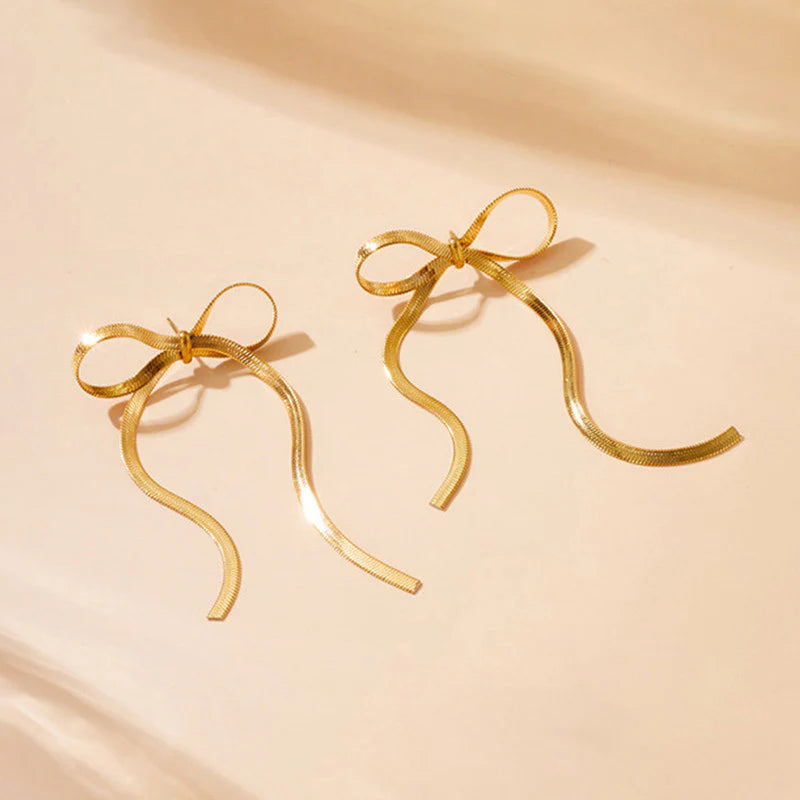 Tied & True – Gold Bow Drop Studs