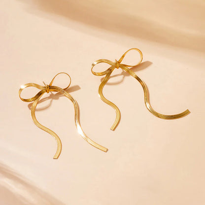Tied & True – Gold Bow Drop Studs