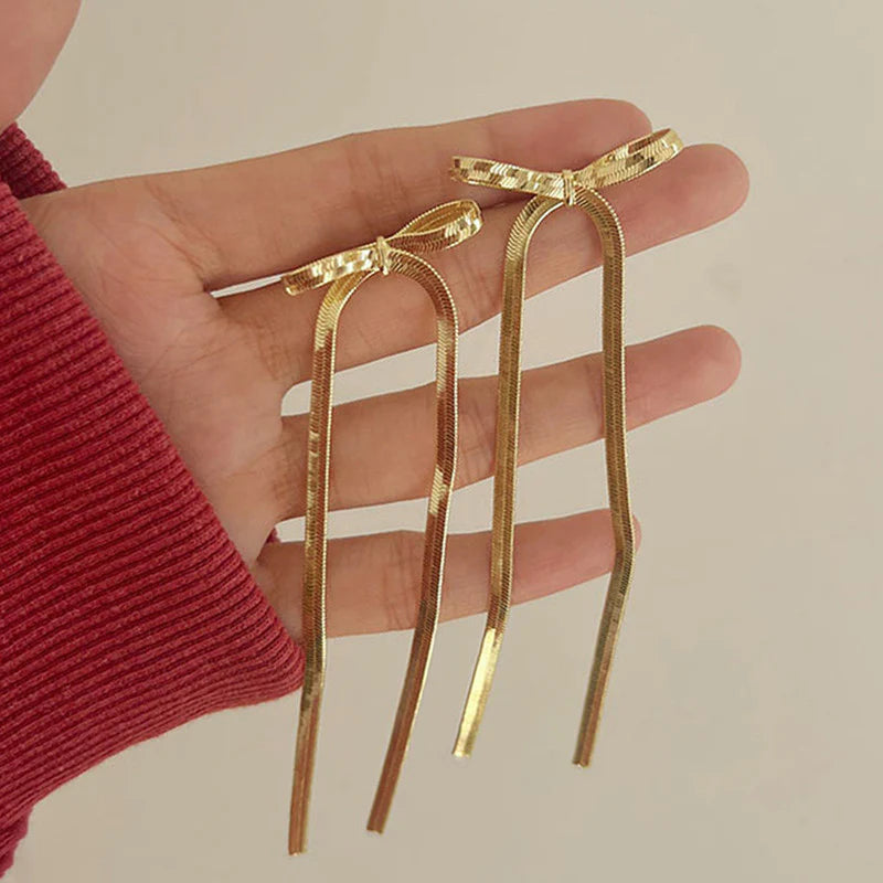 Tied & True – Gold Bow Drop Studs
