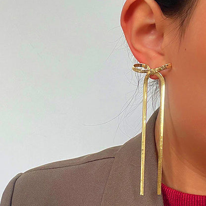 Tied & True – Gold Bow Drop Studs